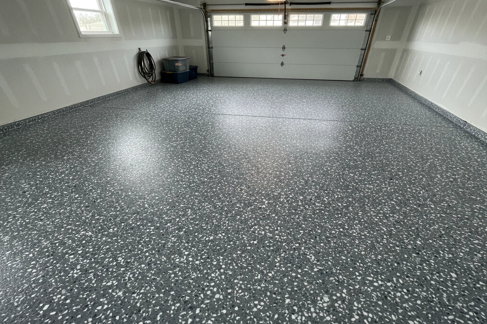 Epoxy flake broadcast application garage floor Keene New Hampshire Cheshire County residential flake system installation Ryan